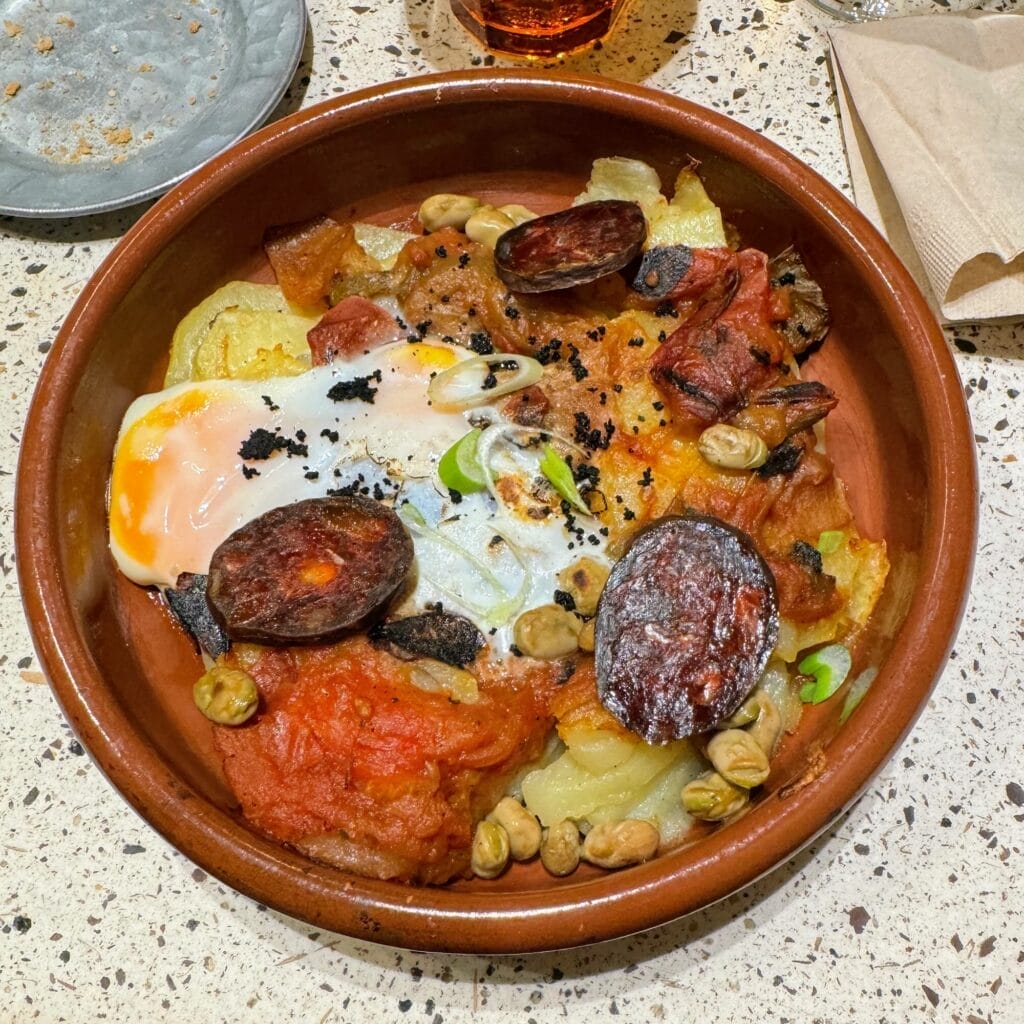 Traditional Spanish baked egg dish with chorizo and potatoes.