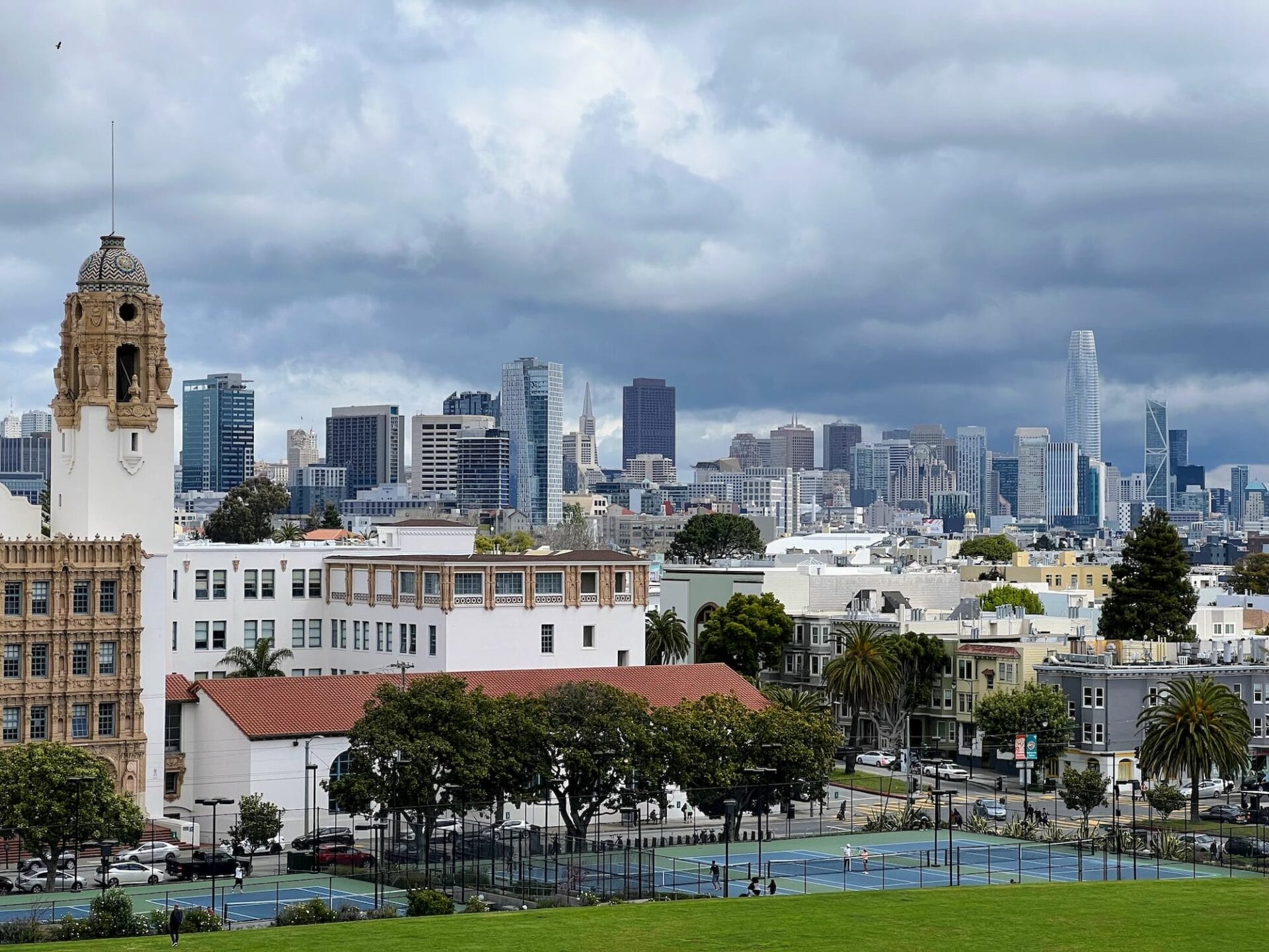 San Francisco skyline with cloudy sky.